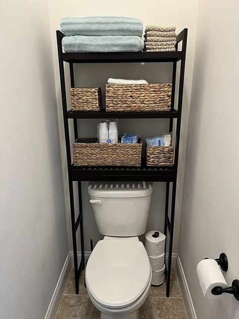 #bathroom #bathroomstorage #bathroomremodel Maximize Bathroom Space, Wood Bathroom Organization, Small Apartment Storage Solutions Bathroom, White And Black Bathroom Accessories, Black Over Toilet Storage, Bathroom Rack Organization, Toilet Rack Ideas, Toilet Rack Decor, Behind The Toilet Storage