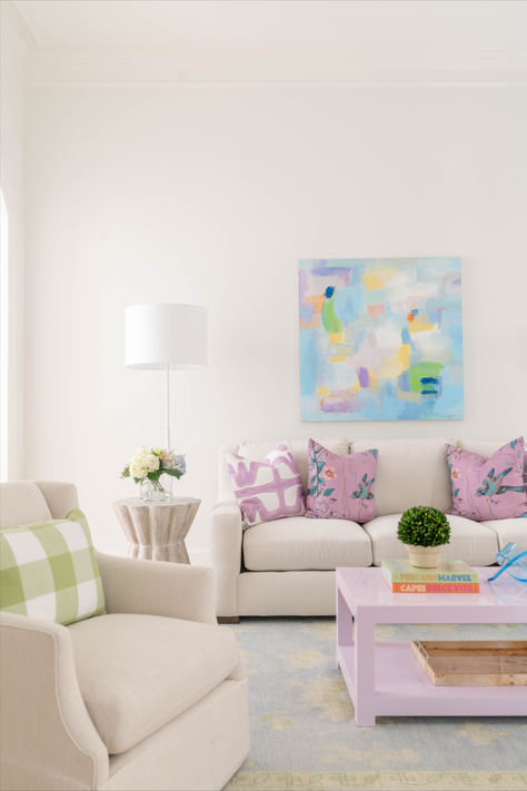 A small hint of color can help structure the space. We designed this family room with a custom coffee table to anchor down the color pallet. As soon as you walk in the first thing you see is lavender but softens when you look around. Living Room Pastel Colors Inspiration, Small Living Room Coffee Table, Dorm Living Room Ideas, College House Living Room, Pastel Living Room Ideas, College Living Room Ideas, Colorful Modern Living Room, Preppy Apartment Decor, Blue And Pink Living Room