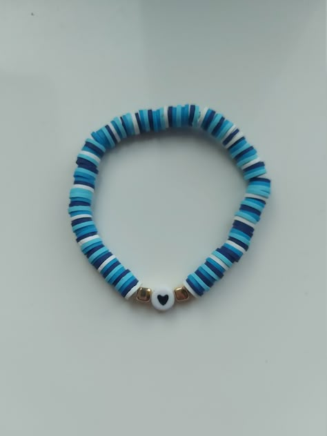 Fun coloured blue heart bracelet! This handmade bracelet is stretchable so it will fit most adults and children's wrist. This bracelet is made out of clay beads that doesn't nip or rip your skin when you wear them.  They are so comfortable! If you have any questions please contact me below. Clay Bracelet Ideas Blue, Dark Blue Clay Bead Bracelet, Clay Bead Bracelet Blue, Matching Clay Bead Bracelets For Couples, Braclets Ideas Clay Beads Easy, Clay Bead Bracelet Ideas For Boys, Blue Clay Bead Bracelets, Blue Heart Bracelet, Bear Activities