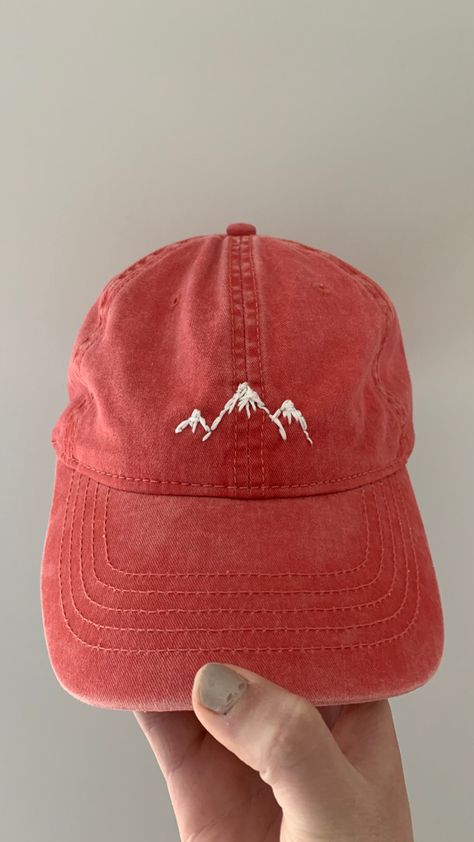 mountains, used a running stitch Embroidery On Cap Diy, Hand Embroidery Mountains, Baseball Hat Embroidery Diy, Embroidered Baseball Caps Diy, Mountains Embroidery, Mountain Embroidery, Embroider Ideas, Clothes Embroidery Diy, Embroidery Caps