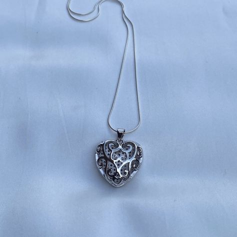 Both sides of this heart pendant are beautiful and will add versatility to your accessories. It comes on a sterling silver snake chain with a delightful silky feel. Wear it by itself or stack it with other necklaces. Necklace- Length: 16 or 20 inches- Width: 0.7mm- Clasp: spring clasp- Metal: 925 sterling silver- Finish: high polishPendant- Size: 23x22x9mm, Hole: 3mm- Material: Brass and Cubic Zirconia- Metal Color: Platinum Orders ship within two days Monday to Saturday Sterling Silver Heart Necklace, Style 2023, Silver Snake Chain, Silver Heart Necklace, Dream Jewelry, Sterling Silver Heart, Pretty Jewellery, Sterling Silver Necklace, Metal Color