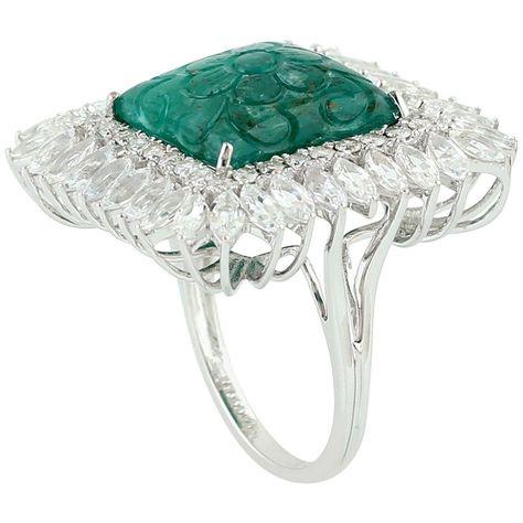 Cast from 18-karat gold. This stunning ring is hand set with 7.21 carat carved emerald, 3.21 carats white sapphire and .56 carats of sparkling diamonds. FOLLOW MEGHNA JEWELS storefront to view the latest collection & exclusive pieces. Meghna Jewels is proudly rated as a Top Seller on 1stdibs with 5 star customer reviews. All items manufactured by us are handmade and can be customized or redesigned. It is a size 7 and can be re-sized at no additional charge. Composition Size-US-7 Total Weight Carved Emerald, Emerald Diamond Ring, Ladies Diamond Rings, Gold Hand, Gold Diamond Ring, Handcrafted Rings, Gold Hands, Pear Shaped Diamond, Emerald Cut Diamonds