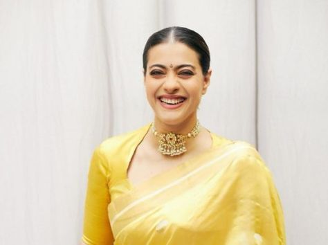 Kajol Devgn looks strikingly beautiful in a yellow silk saree at Lalbaug!