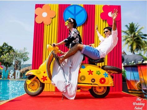 photo op with a colourful yellow scooter with flowers | Indian wedding photoshoot ideas | Indian wedding photo booth ideas | The wedding Salad | The ultimate guide for the Indian Bride to plan her dream wedding. Witty Vows shares things no one tells brides, covers real weddings, ideas, inspirations, design trends and the right vendors, candid photographers etc.| #bridsmaids #inspiration #IndianWedding | Curated by #WittyVows - Things no one tells Brides | www.wittyvows.com Haldi Kunku, Goa Wedding, Booth Decor, Indian Wedding Photos, Wedding Photo Booth, Chalkboard Wedding, Best Wedding Planner, Outdoor Wedding Decorations, Indian Wedding Decorations