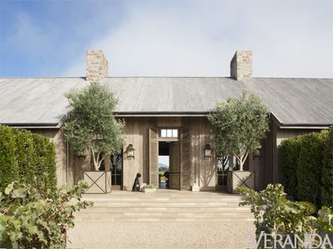 Consider the architecture first. Patina Farm, Veranda Magazine, Farmhouse Exterior Design, Porte Cochere, Modern Farmhouse Exterior, Front Entrance, Modern Barn, Farmhouse Exterior, Barn Style