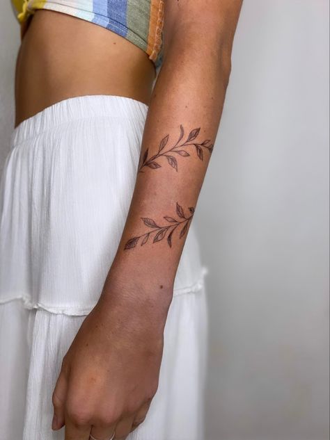 Leafy, vine, wrist wrap tattoo Laurel Arm Band Tattoo, Wrap Around Vines Tattoo, Arm Ivy Tattoo, Vine Around Forearm Tattoo, Christian Wrap Around Tattoo, Olive Branch Band Tattoo, Floral Bicep Wrap Tattoo, Ivy Arm Wrap Tattoo, Vibe Wrap Tattoo