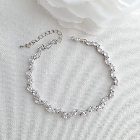 A delicate wedding bracelet created with sparkling marquise cubic zirconia crystals. The bridal bracelet is slim and dainty of approximately 4mm width to add a touch of glamour to your wrist. A versatile bracelet will make a great addition to your wedding jewelry and can be worn after for many occasions.Material used is rose gold plated brass. Also available in rhodium/silver and 14k gold finish.- Length is 6.75 inches and comes with a 3 cm extension chain, Bracelet is 4 mm wide.Can be matched w Gold Bracelet Wedding, Poetry Design, Silver Leaf Bracelet, Delicate Wedding, Gold Leaf Earrings, Rose Gold Bridal, Leaf Bracelet, Leaf Jewelry, Matching Jewelry