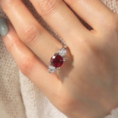 - - - D O U B L E A C C E N T - - - Double Shine Double Brilliance Double Value Triple Brilliance Ruby Ring - Platinum-Plated Sterling Silver Discover Triple Brilliance Ruby Ring featuring round-cut ruby red cubic zirconia stones, a stunning three stone setting, and a platinum-plated sterling silver band for enduring shine and comfort. Perfect for any occasion! - - - D E S C R I P T I O N S - - - * Handmade Excellence: Unique, artisan-crafted jewelry that stands out. * Superior Materials: Triple-layer platinum-plated sterling silver for long lasting. * Proven Satisfaction: Over 18,200 reviews with a 4.9/5 average rating. * Ethical Elegance: Responsibly sourced materials for conscious luxury. * Affordable Luxury: Premium quality at reasonable prices, direct to you. 💎 Features Featuring a 2 2 Carat Ring, Pink Stone Rings, Romantic Story, Engagement Ring Platinum, Wedding Anniversary Ring, Ruby Color, Jewelry Girl, Silver Top, Gold Rings Jewelry