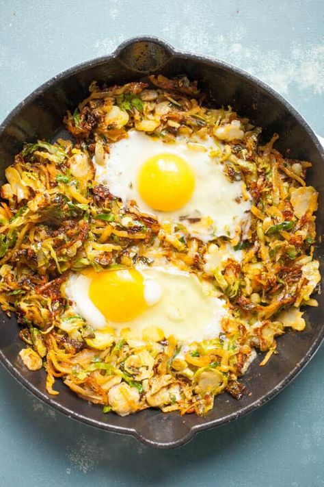 This simple Brussels Sprouts breakfast skillet has some amazing fall flavors and is my new favorite take on hash. I cook mine in a cast iron skillet with potatoes, bacon, and eggs! Dig in. | macheesmo.com #breakfast #skillet #easyrecipes #brusselssprouts Brussels Sprouts And Bacon, Sprouts And Bacon, Sauteed Brussel Sprouts, Keto Egg Recipe, Breakfast Skillet Recipes, Fall Recipes Breakfast, High Fiber Breakfast, Breakfast Skillet, Bacon Brussel Sprouts