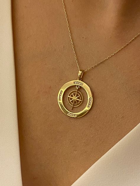 "ABOUT PRODUCT This 14K solid gold Compass with Zirconia Stones necklace is beautifully designed and hand crafted with our associates to make this a special gift for your loved ones. Knowing the value of our customers, We prepare each piece with extra care and attention. ITEM DETAILS Material: 14K Gold Approx: 2.70 gram Available colors: Gold, Rose Gold, White Gold Available Sizes: 14\" to 20\" ✪ 14k Solid Gold ( Certification will be included with your order ) ✪Available 14K White, Yellow, Rose Compass Gift Ideas, Gold Pendant Designs Modern, Necklace Compass, Gold Compass Necklace, Travel Inspired Jewelry, Small Heart Necklace, Compass Jewelry, Custom Pendant, Stones Necklace