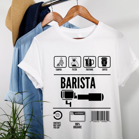 Introducing our new Barista T-shirt! Perfectly designed for those who love coffee and make it with passion. Featuring a quirky and fun graphic, this T-shirt is made with premium quality cotton, ensuring maximum comfort for all-day wear. Whether you're behind the counter or simply out and about, this T-shirt will scream your love for coffee and unparalleled brew-making expertise. Get ready to impress your customers and flaunt your skills in style! Order now and add a touch of personality to your Barista T Shirt, T Shirt Coffee Design, Coffee Shop Tshirt Design, Barista Uniform Coffee Shop, Coffee Shop Shirt Design, Coffee Graphics Design, Coffee Shop Uniform, Coffee T Shirt Design, Coffee Shop Shirt