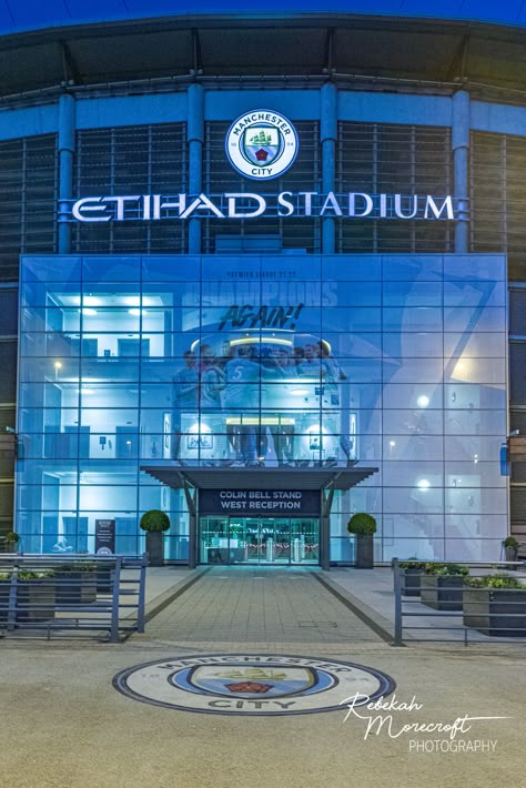 "Manchester City FC West Reception. I am a professional photographer from Manchester, and my stepson developed a love for Man City FC and Haaland. Inspired by his enthusiasm, I decided to capture some pictures of the iconic Etihad Stadium. After patiently waiting for the perfect weather and a day when we could bring my stepson along, we finally visited the stadium on May 7th.  As we explored, we couldn't help but notice the numbers \"93:20\" displayed on what seemed to be a digital clock. We wer Etihad Stadium Aesthetic, Etihad Stadium Wallpaper, Man City Aesthetic, Manchester City Aesthetic, Man City Stadium, Manchester City Stadium, City Of Manchester Stadium, Manchester City Wallpaper, Manchester City Football Club