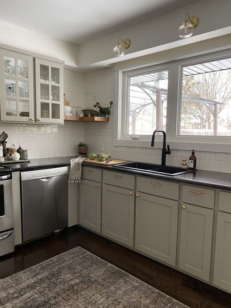 Taupe Kitchen Cabinets, Give Me A Minute, Black Granite Kitchen, Modernize Your Home, Black Kitchen Countertops, Taupe Kitchen, Dark Countertops, Industrial Kitchen Design, Black Granite Countertops