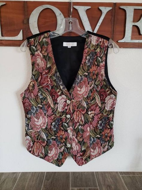 "Corena Lady's Boutique Vest Floral Brocade Vest Fully Lined - Even Back Satin Fabric Buttons Down Front - 4 Buttons Princess Seams Satin Ribbon and Buckle at Back For a More Fitted Look Soft Warm Pinks Blues Greens Creams 36\" Bust 34\" Waist (unbuckled at back) 20\" to 24\" Length (Back and Front Points Remember you need to fit within the measurements given for the best fit, keeping into consideration decade/style and fit of a vintage garment. Measure a similar item in your closet as reference Vest Summer Outfits For Women, Embroidery Vest Outfit, Vintage Vest Outfits For Women, Floral Vest Outfit, Vintage Vest Outfit, Floral Waistcoat, Brocade Waistcoat, Victorian Vest, Brocade Vest