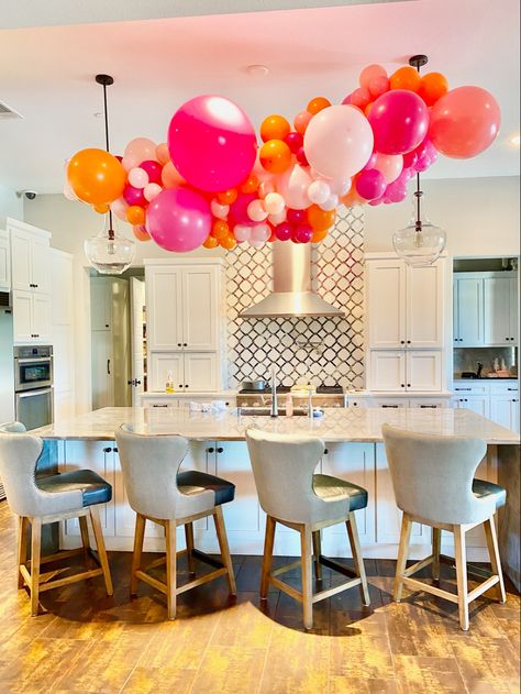 Balloon Garland Above Kitchen Island, Balloons On Chandelier, Deck Balloon Decor, Kitchen Island Balloon Decor, Kitchen Island Balloon Garland, Balloon Arch Over Kitchen Island, Balloon Garland From Ceiling, Balloon Garland Over Kitchen Island, Kitchen Balloon Decoration