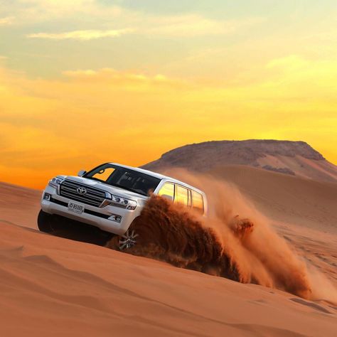 Begin your Dubai desert safari with a prompt pick up from your accommodation in a 4WD vehicle. After the 40-minute drive to reach the Red Dunes for a safari, you can take a quad bike ride if you are looking for more adventure. Enjoy the Dune Bashing activity and try sandboarding with a photo secession. Later, move on to the Bedouin camp where Arabian Qahwa, Luqaimat, dates, and soft drinks will be served as a sign of welcome. You can wear traditional Arabian attire and pose for more photographs. Safari Jeep, Dubai Safari, Dubai Tourism, Dubai Desert Safari, Desert Safari Dubai, Bbq Dinner, Dubai Tour, Sand Surfing, Desert Safari