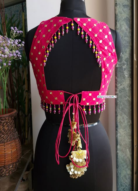 This Made to Order/Made to Measurement/Custom Made Indian Ethnic Blouse. - Fabric - Embroidered Georgette - Color - Hot Pink - Padded - Princess Cut - V Neck - Lined - Back String Closure with tassels - Backless with beads embellishment - Beads around the waist - Extra margin and extra stitches included in the blouse PLEASE NOTE: BUYERS ARE RESPONSIBLE FOR ANY CUSTOMS AND IMPORT TAXES THAT MAY APPLY. This is a made to order product. If you opt for 'Made To Measurement Option', we will provide a measurement template and you can share the measurements likewise. If you want to opt for 'Standard Size', Please refer to the size chart provided in the listing. Shipping: Standard Shipping is done by DHL ecommerce and it mostly takes 2 to 3 weeks to deliver after dispatch. Express Shipping is done Sleeveless Blouse Designs For Lehenga Back, Backless Blouse Pattern, 2 Colour Blouse Designs, Blouse Back Model, Back Of Blouse Designs, Shell Blouse Design, Strap Blouses For Saree, Back Designs For Blouse, New Blouse Back Designs