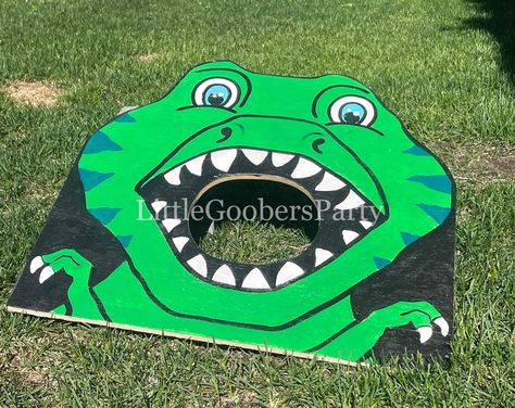 Dino Toss Game, Dinosaur Cornhole, Dinosaur Bean Bag Toss, Dino Party Games, Dino Crafts, Dinosaur Party Games, Dino Craft, Game Dino, Just To Say Hi