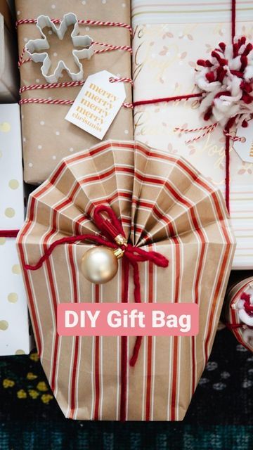 Christina, The DIY Mommy® on Instagram: "Have you ever tried making a gift bag from wrapping paper? I've done this when I need to wrap something like a stuffed animal, oddly shaped toy, or round item. This accordion fold method for the top is inspired by @beeandblooms! #thediymommy #giftwrappingideas #giftwrap #giftwrapping #christmashack"