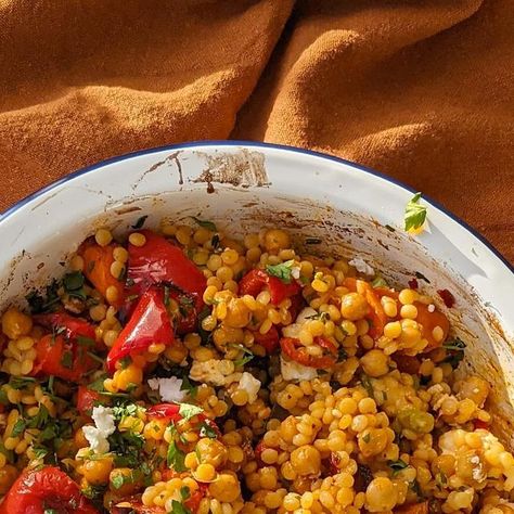 The Greedy Model on Instagram: "A prep-ahead lunch or dinner even, this harissa carrot & red pepper giant couscous salad is so easy but with lots of flavour behind it. It is very hands off, you just have to roast the veg in the oven, adding in as you go. It keeps very well too!

Serves 2-3 (depends if serving alongside something else eg chicken or salmon!)
2 carrots, peeled and chopped into uneven chunks
1 red pepper, chopped
1 spring onion, sliced
1/2 large red chilli, sliced (leave out if you don't love heat)
Parsley, chopped
150g giant couscous
1 tin of chickpeas (400g, drained)
1 tbsp harissa paste
1 tsp ground cumin
75g feta, crumbled 
2 tbsp sherry vinegar (white/red wine vinegar would also work)
Salt

1. Heat the oven to 200c. In a roasting tin, add the carrots, chilli and red peppe Giant Couscous, Harissa Paste, Sherry Vinegar, Couscous Salad, High Protein Low Carb, Wine Vinegar, Red Chilli, Spring Onion, Red Wine Vinegar