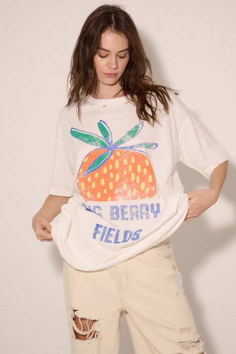 Distressed, garment washed graphic t-shirt. Vintage-style strawberry graphic print with "Big Berry Fields" text. Torn and distressed detailing at neckline, cuffs, and hem. Round neckline. Short sleeves. Drop shoulder. Oversized fit. 100% Cotton. Imported top designed and printed in LA. Model wears size S. Oversize Graphic Tee, Strawberry Graphic, Oversized Graphic Tee, Strawberry Print, Clean Girl, Winter 2024, Oversized Fits, Drop Shoulder, Round Neckline