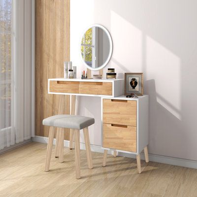 This vanity set comes complete with a cushioned stool and touchscreen adjustable mirror to help you get ready in the morning. It's made from solid and engineered wood with a two-tone white and rustic light brown finish. The table rests on splayed legs, giving your bedroom or guest room a hint of mid-century modern style. It also features two drawers with cut-out handles that are just right for makeup, brushes, and jewellery. An upholstered linen cushion on the stool keeps you comfy while you do your routine. Plus, the mirror in this set features a round silhouette that offers the right amount of light. Full assembly is required. | George Oliver Vanity Desk w/ 3 Adjustable Lighting Modes Mirror, w/ 5 Drawers & Cushioned Stool, Adjustable Storage Cabinet | C111266647 | Wayfair Canada Rustic Light, Mirrored Vanity Desk, Vanity Table Set, Large Vanity, Small Space Bedroom, Makeup Table Vanity, Make Up Desk Vanity, Small Vanity, Bedroom Size