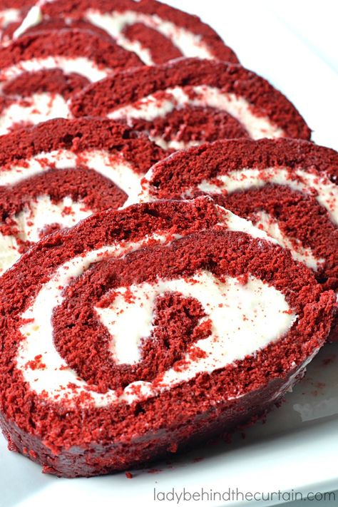 Red Velvet Cake Roll. A beautiful bright red sponge cake, with a hint of chocolate, light, fluffy, and a cream cheese filling—the perfect holiday dessert. Red Velvet Roll, Red Velvet Cake Roll, Pistachio Cheesecake, Cake Rolls, Cake Roll Recipes, Christmas Sprinkles, Velvet Cupcakes, Holiday Dessert, Frozen Cake