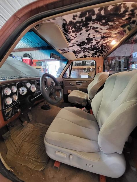 Cow Print Truck Headliner, Inside Of Truck Ideas, Old Car Interior Aesthetic, Chevy Truck Interior Ideas, Aesthetic Truck Interior, Cowhide Truck Interior, Cowhide Headliner Truck, Inside Truck Aesthetic, Truck Customization Ideas