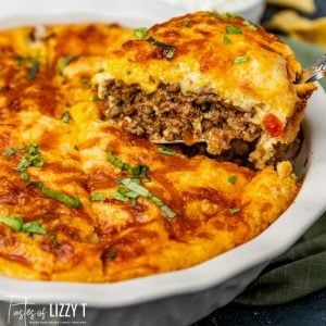 The ultimate in comfort food, this Impossible Taco Pie is layered with ground beef, Rotel, cheddar cheese and a Bisquick topping. It's an easy family dinner recipe. Impossible Taco Pie, Bisquick Recipes Dinner, Taco Pie Recipes, Gluten Free Bisquick, Taco Pie, Bisquick Recipes, Green Chiles, Ground Beef Casserole, 12 Tomatoes