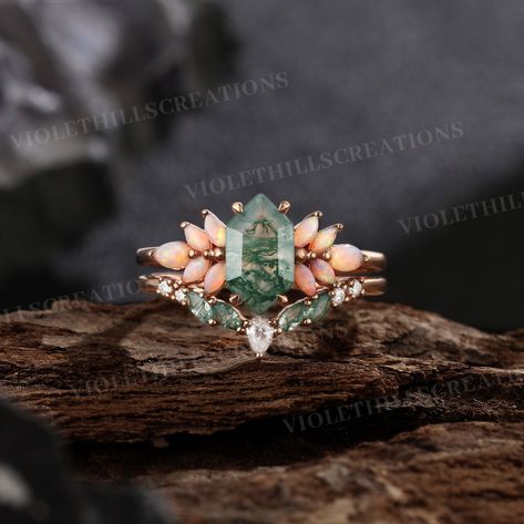 Long Hexagon Moss Agate Engagement Ring Set Cluster Natural Opal Ring Promise Ring Moss Agate Wedding Band Rose Gold Ring Anniversary Ring Similar engagement ring set: https://www.etsy.com/listing/1775556599 Engagement ring: https://www.etsy.com/listing/1694736505 Moissanite Engagement Ring Set: https://www.etsy.com/listing/1727269528 Link to the Black onyx ring set: https://www.etsy.com/listing/1775025437/ ⨞Handmade item Crystal Rings Wedding, Geode Engagement Ring, White Gold Cluster Engagement Ring, Cottagecore Engagement Rings, Hexagon Wedding Ring Set, Natural Moss Agate Engagement Ring, Emerald Opal Engagement Ring, Funky Engagement Rings, Fairy Wedding Ring