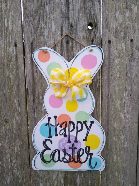 "Y'all check out this adorable and festive Easter Bunny door hanger!! So perfect for the season. Hand painted on 1/4\" wood and varnished for protection. 18\" tall x 11\" wide. Jute hanger and ribbon accent." Easter Wood Crafts, Valentines Door Hanger, Bunny Door Hanger, Wood Door Hanger, Easter Door Hanger, Summer Door Hanger, Diy Ostern, Easter Door, Spring Easter Crafts