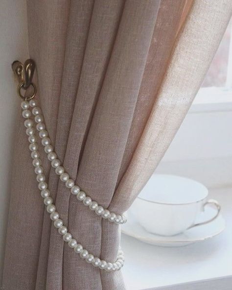 A curtain tieback is a decorative or functional accessory used to hold curtains or drapes to the side, allowing more light into the room or creating a decorative effect. They come in various styles and materials, like ropes, tassels, or metal hooks. They offer versatility in curtain styling, allowing you to change the look of the space by adjusting the position of the tiebacks or swapping them out for different styles. Overall, even though they are small details, curtain tiebacks can have... Curtains Holder, Instagram Decoration, Classy Rooms, Handmade Curtains, Cute Curtains, Plain Curtains, Curtain Holder, Curtains Holdbacks, Stylish Curtains