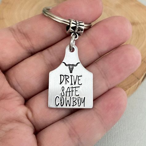 Double Sided Drive Safe Cowboy, Gift for Him, Boyfriend Gift, 16th Birthday Gift, First Car Gift, Husband Gif, Western, Rodeo, Bullhorn ♥ This listing includes: . 20mm x 28mm brush finished aluminium cattle tag . High quality stainless steel keyring . Comes in our beautiful signature cotton pouch ♥ More collections for Him: http://etsy.me/2sgTx61 ♥ All collections from ANES + EVE https://www.etsy.com/au/shop/AnesandEve?ref=l2-shopheader-name ♥ Please review our shop policies before ordering http Welder Boyfriend Gifts, Western Gifts For Him, Gifts For Your Country Boyfriend, Country Birthday Gift Ideas, Western Men Gifts, Cowboy Boyfriend Gifts, Western Gifts For Boyfriend, Blue Collar Boyfriend Gifts, Gifts For Country Boyfriend