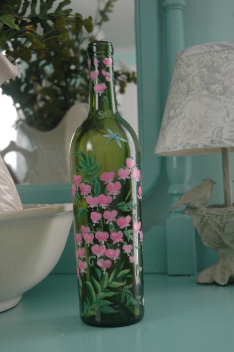 Here is a hand painted wine bottle that I did with pink bleeding heart flowers covering the bottle.  SOLD Painting Ideas Flowers, Bottle Paint, Wine Bottle Vases, Flowers Wine, Hand Painted Wine Bottles, Hand Painted Bottles, Flower Bottle, Glass Painting Designs, Glass Bottle Diy