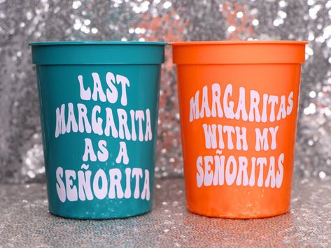 Bottoms up! Have your whole vineyard loving bachelorette crew drinking in style with these MARGARITA themed plastic stadium cups.  🆃🅾  〰️Choose the amount, design and color of the cups you would like to order.  〰️Designs: MARGS AND MATRIMONY, LAST MARGARITA AS A SENORITA, or MARGARITAS WITH MY SENORITAS. 〰️Don't forget to purchase a white cup for the bride! 〰️Scroll through the product listing's photos for cup colors and shipping options.   〰️Each stadium cup holds 16 oz of your favorite party Bachelorette Party Ideas Margaritas, Bachelorette Margs And Matrimony, Bachelorette Party Margs And Matrimony, Marks And Matrimony Bachelorette Party, Margarita Party Theme, Margs And Matrimony Hens Theme, Last Margarita As A Senorita, Margs And Matrimony Pool Day, Margarita Veil Bachelorette