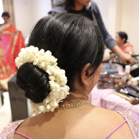 Low bun with jasmine flower created for mother of the groom by Yugala Hair Bun With Jasmine Flowers, Western Hair Styles, Western Hair, Jasmine Hair, Flower Bun, Nauvari Saree, Jasmine Flowers, Easy Bun Hairstyles, Raleigh Wedding