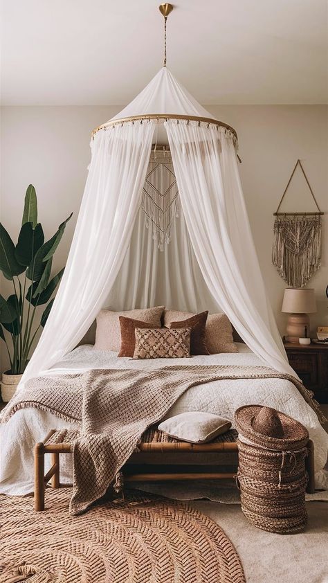 A romantic boho bedroom with a flowing canopy draped over the bed, surrounded by warm lighting and cozy decor.