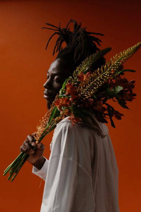 Man in White Thobe Holding Flowers · Free Stock Photo Black Hands Holding Flowers, Photoshoot Holding Flowers, Man With Flowers In Hand, Man Holding Flowers, Men Flowers, Aesthetic Flowers Bouquet, Hands Holding Flowers, Flowers For Men, Holding A Bouquet