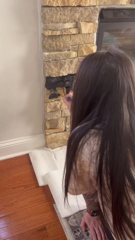 A DIY enthusiast has shared how she gave her stone fireplace a brand new look with a bargain buy – however, the makeover hasn’t gone down a treat amongst social media users. Social media user and craft fanatic Kelsea, from the US, was keen to have a black fireplace in her home – but perhaps […] Black Wash Stone Fireplace, Painted Stone Fireplace Black, Black Painted Stone Fireplace, Paint Stone Fireplace, Black Rock Fireplace, Black Stone Fireplace, Painted Rock Fireplaces, Black Fireplace Surround, Painted Mantle