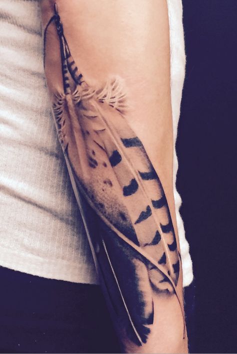 Feather tattoo Feather Tattoo Sleeve For Women, Feather Band Tattoo, Indian Feather Tattoos Men, Feather Forearm Tattoo Women, Men Feather Tattoo, Forearm Feather Tattoo, Native American Hawk Tattoo, Pheasant Feather Tattoo, Cardinal Feathers