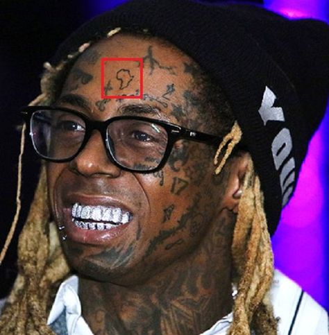 Lil Wayne’s 89 Tattoos & Their Meanings | Body Art Guru Lil Wayne Tattoos Face, Lil Wayne Tattoos Ideas, Lil Wayne Tattoos, Lil Wayne News, Inner Lip Tattoo, Green Martian, Africa Tattoos, Left Arm Tattoos, Money Tattoo