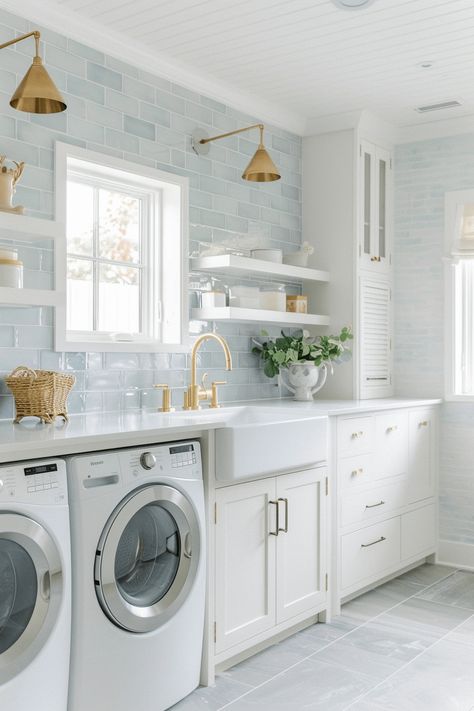 coastal laundry room with light blue subway tiles and white farmhouse sink Blue Backsplash Laundry Room, Coastal Style Laundry Room, Hamptons Style Laundry Room, Cape Cod Beach House Interior Design, Tile For Laundry Room Wall, Classic Coastal Home, Coastal Farmhouse Laundry Room, Beachy Laundry Room, Coastal Home Inspiration