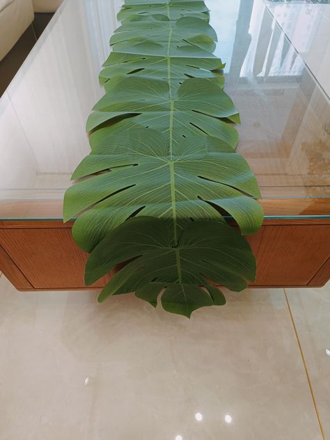 PRICES MAY VARY. Arijorja Products Include: 2 artificial palm leaf Table Runners。 Artificial Palm Leaves Table Runners: These are not individual artificial tropical palm leaves; But all the blades are connected to each other, forming a whole Table Runners; The size of a single leaf is approximately 13.4 x 11.8 inches; The length of the entire tablecloth is 72 inches, which is very suitable for Luau Theme Party and tropical Hawaiian themed party table decoration. Material: The product is made of Island Theme Party Decorations, Greek Theme Party Decorations, Homecoming Decorations Hallway, Tropical Retirement Party, Palm Leaves Table Runner, Palm Tree Party, Hawaiian Cowboy, Lion King Party Decorations, Greek Party Theme