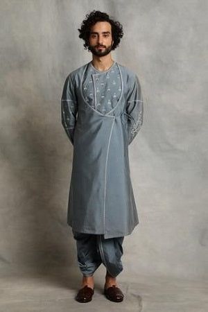 Originating from Rajasthan’s culture and tradition, the Angrakha style kurta features a unique overlapping pattern reminiscent of the royal era. This style adds a regal touch to your wardrobe, making it a great choice for festive occasions or cultural events. Angharka Style, Angrakha Style Kurta, Stylish Boy Clothes, Grey Kurta, Angrakha Kurta, Sherwani For Men Wedding, Angrakha Style, Kurta Cotton, Kurta Men