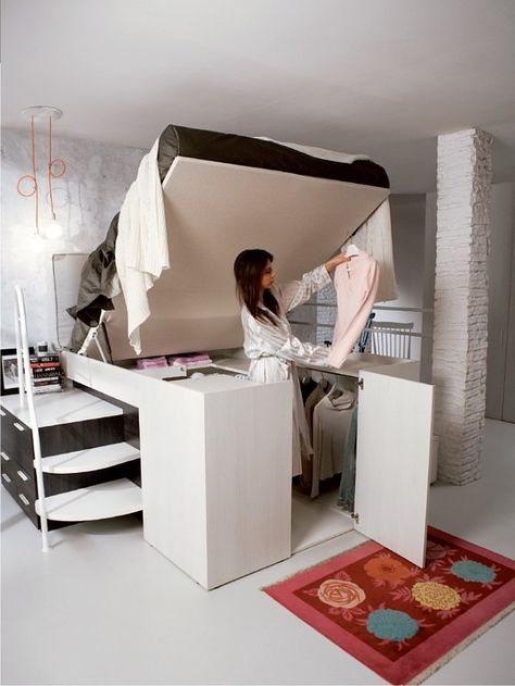 When not in use, this bed just looks tall and stylish. But really it's a cover for a smart closet under the lofted mattress — all you have to do is lift it up when you want to get dressed, then pull it down to make it all go away.  See more at Dielle.   - Cosmopolitan.com Cama Closet, Creative Bed, Små Rum Lidt Plads, Design Ložnic, Smart Closet, Space Saving Beds, Italian Designers, Built In Bed, Deli Food