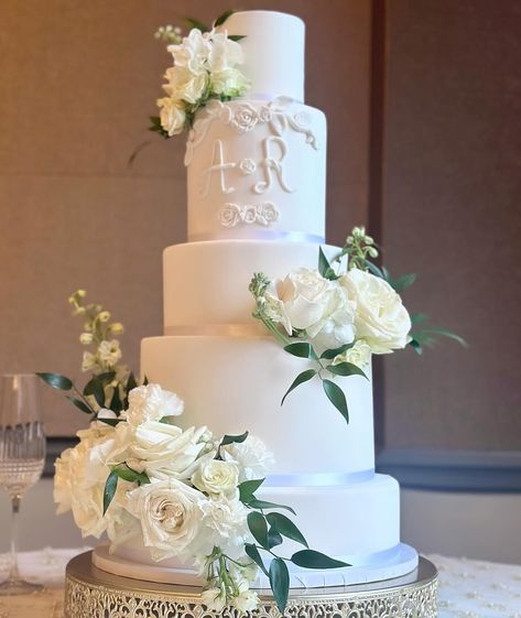 Smooth Fondant 5 tier cake with Bride & Grooms initials. The cake is styrofoam inside but we offer the option to have a cut out in the back for a slice of cake.  White satin ribbon around each tier is also included.  Florals and stand not included. Classic Tiered Wedding Cake, Four Tier Wedding Cakes, 4 Tier Wedding Cake With Flowers, Modern White Wedding Cake, Timeless Wedding Cake, 5 Tier Cake, Faux Wedding Cake, All White Wedding Cake, 5 Tier Wedding Cake