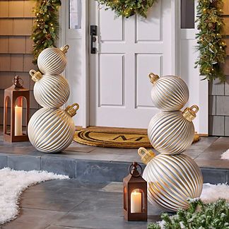 Oversized holiday accent for outdoor or indoor display . Whimsical version of a traditional porch topiary, over 3 ft. tall . Handpainted in shining silver and gold . Dimensional, ribbed texture closely mimics traditional ornaments . Sit directly on a flat surface or display in our Trianon Topiary Pedestal Planter (sold separately) . Durable and weather-ready, lasts for seasons to come . Polyester resin/styrene/fiberglass construction . Arrives in three separate sections with some assembly; no to Porch Topiary, Luxury Christmas Decor, Pedestal Planter, Traditional Porch, Traditional Ornaments, Gold Christmas Decorations, Christmas Front Porch, Christmas Porch Decor, Holiday Garlands