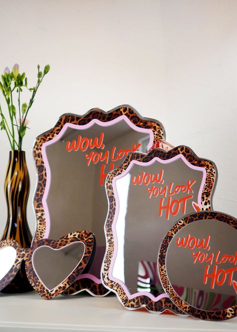 Wow - You Look HOT! And don't you forget it - self love reminder with our leopard print and lippy disc mirror! Each mirror features a colourful & fun design with a positive message to make you feel FAB or we can all relate too! They look great on your dressing table, wall, or even the perfect gift. Available in either mini 15cm or 30cm sizes Acrylic mirror No hanging on the back Recommend hanging using a small command strip or white tack. Neon Sign Above Mirror, Words On Mirror Aesthetic, Hollywood Glam Room Decor, Cute Wall Mirror, Girly Eclectic Decor, Cricut Mirror Projects, Leopard Print Room Decor, Cheetah Mirror, Leopard Print Bedroom Ideas