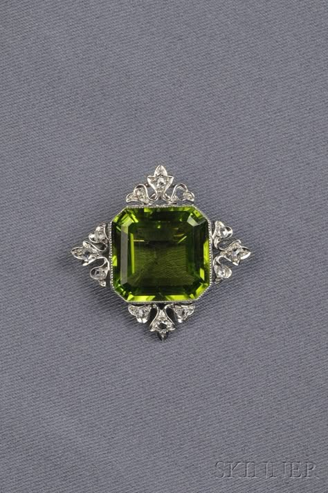 Sold at auction Edwardian Platinum, Peridot, and Diamond Brooch/Pendant, Marcus & Co. for sale in auction. Auction Number 2539B, Lot Number 687. Bid on similar items for sale at auction Peridot Brooch, Edwardian Jewelry, Peridot Jewelry, Antique Brooches, Diamond Brooch, Deco Jewelry, Maker's Mark, Vintage Jewels, Gorgeous Jewelry