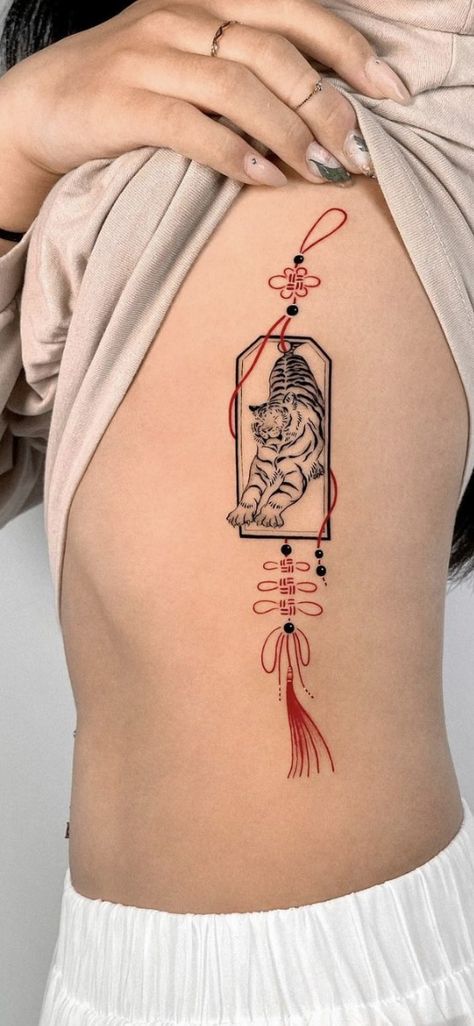 Unique Asian Tattoo, Asian Tassel Tattoo, Astrological Back Tattoo, Korean Back Tattoo Women, Small Asian Tattoo Ideas, Japanese Inspired Tattoos Sleeve, Traditional Chinese Tattoo Art, Asian Tattoos For Women Japanese Style, Traditional Asian Tattoo Art